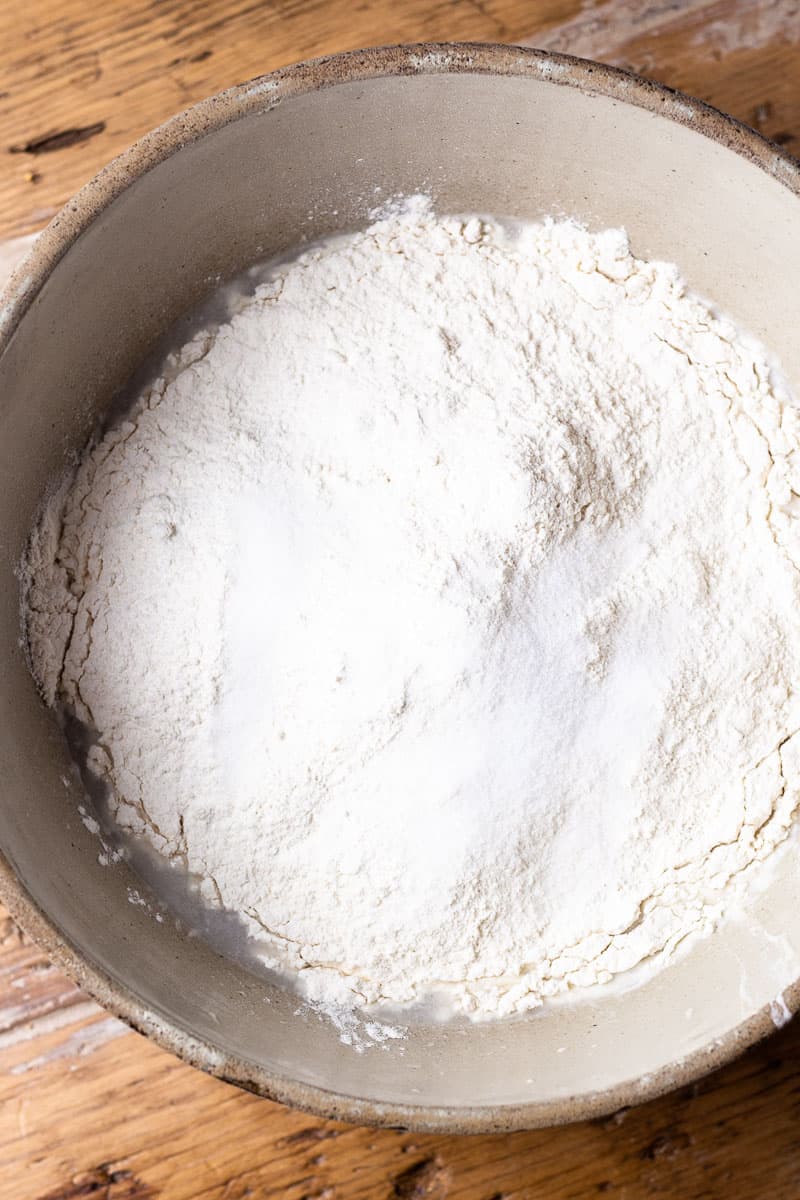 sourdough stater, water, flour and salt in a bowl