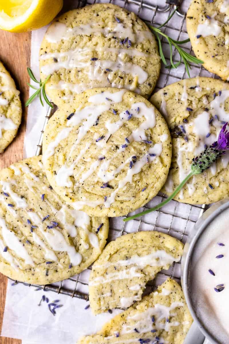 lavender earl grey cookies on a parchment paper with a cup of lavender earl grey tea