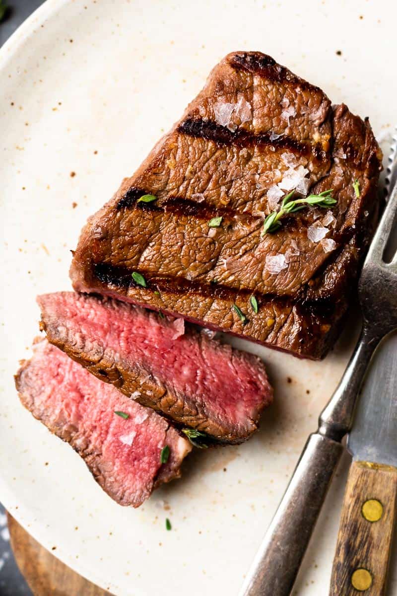 sliced elk steak on a plate