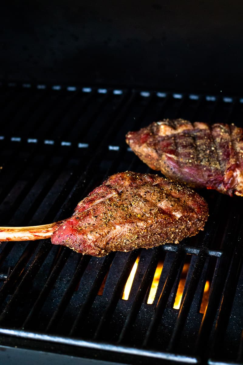 bison tomahawk steaks on the grill