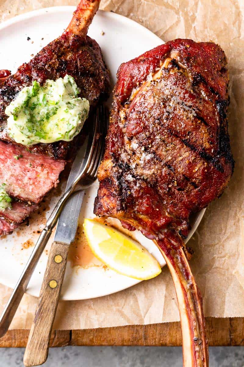 two grilled bison tomahawks steak on a plate