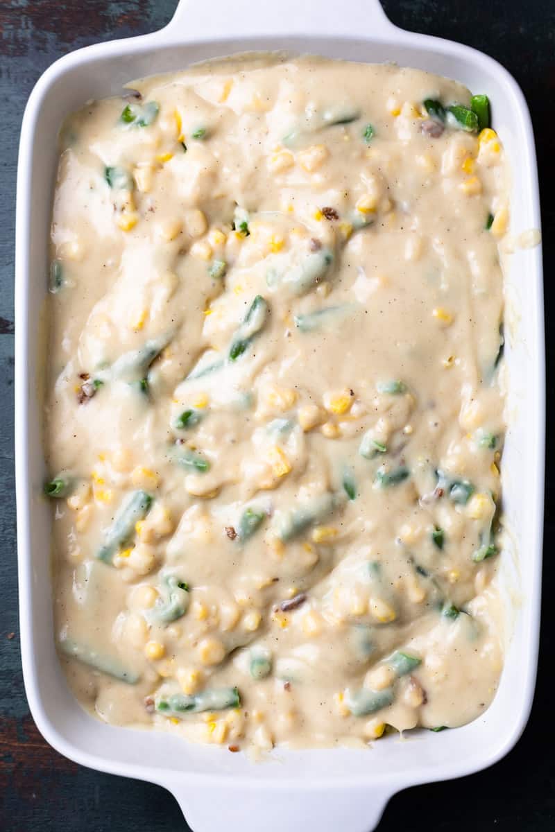 ground beef, frozen corn and green beans and cream sauce in a baking dish