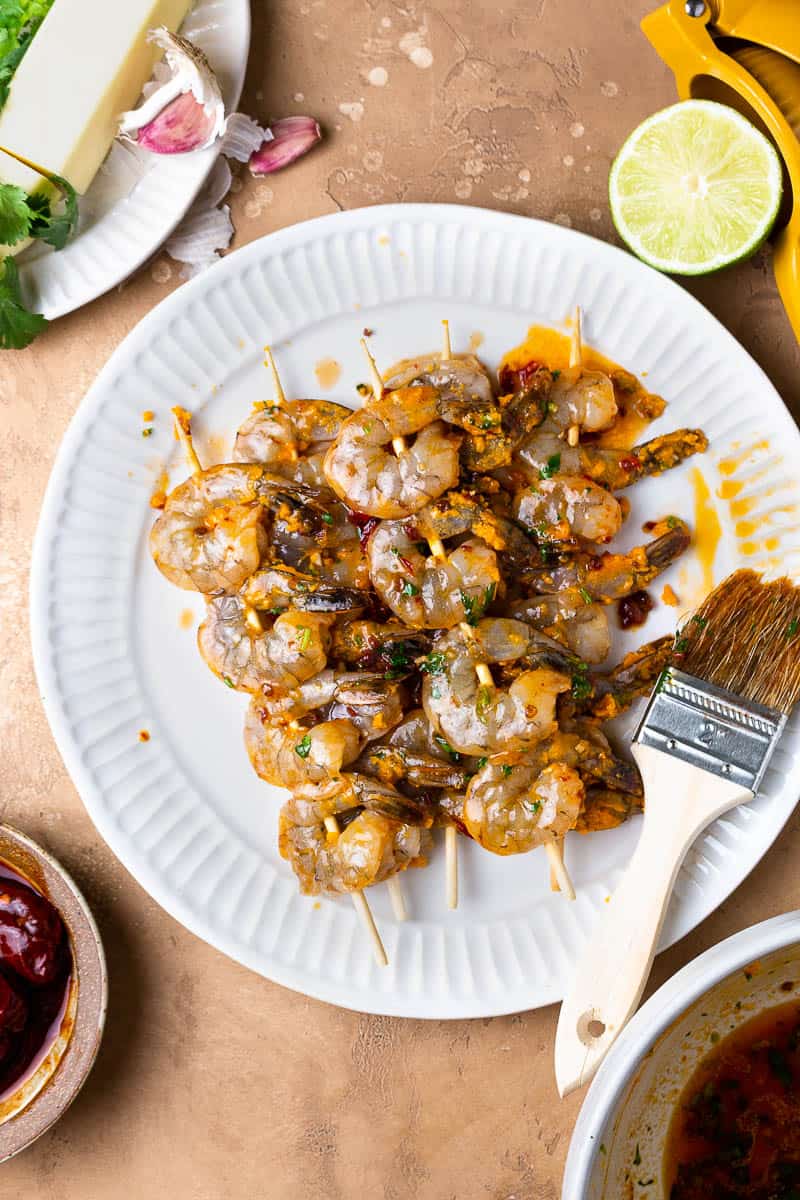 shrimp skewers on a plate and brushed with chipotle honey butter