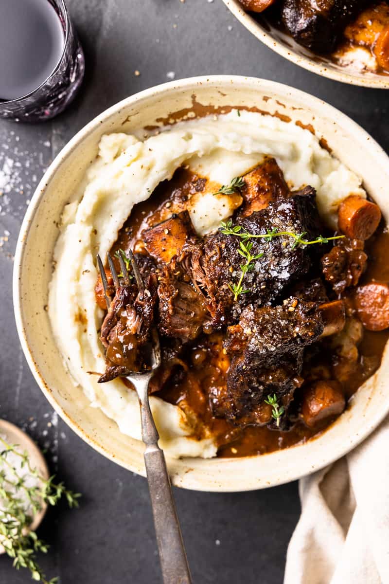 bowl of mashed potatoes and bison short ribs in a bowl
