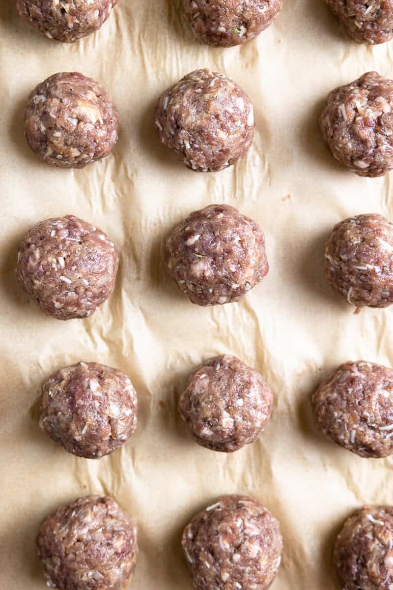 uncooked venison meatballs on a sheet pan