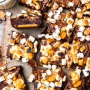 s'mores brownies cut into squares and served with a glass of milk