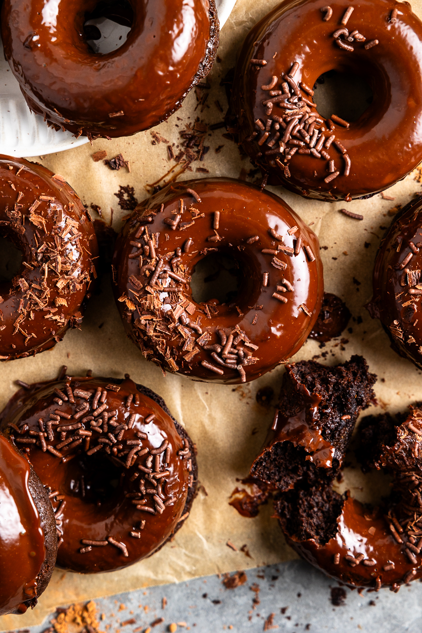 brownie donuts aka bronuts dipped in chocolate ganache and top with chocolate sprinkles