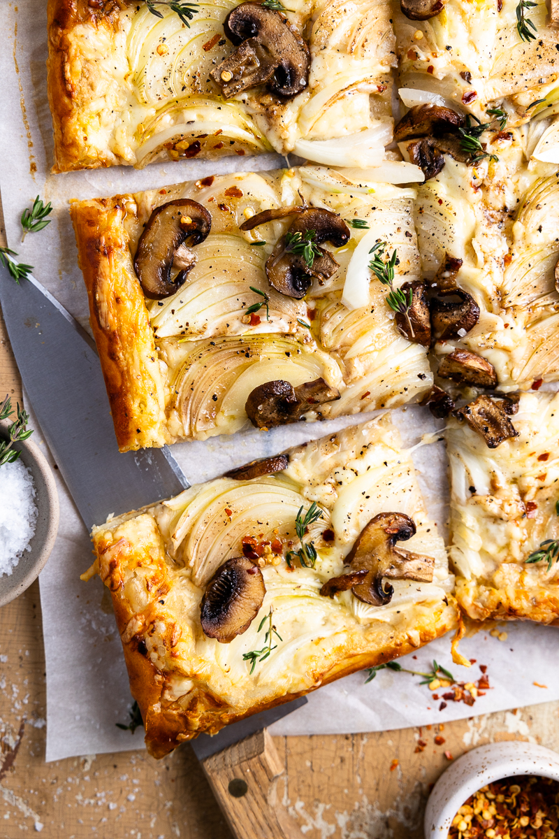 baked onion and mushroom puff pastry tart cut into 6 pieces
