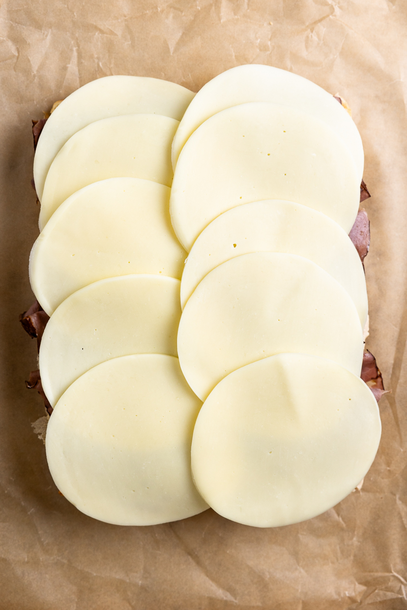 provolone cheese slices on top of the roast beef