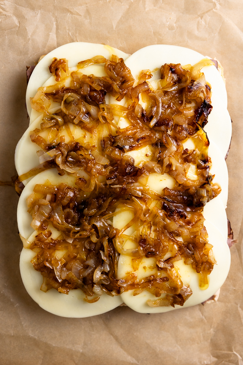 caramelized onions on top of the cheese