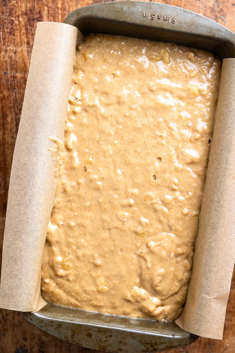 banana bread batter in a loaf pan