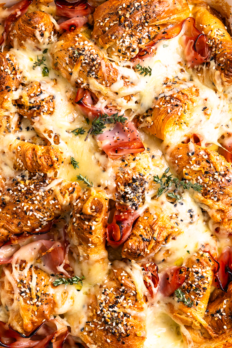 close up of the baked breakfast casserole garnished with fresh thyme