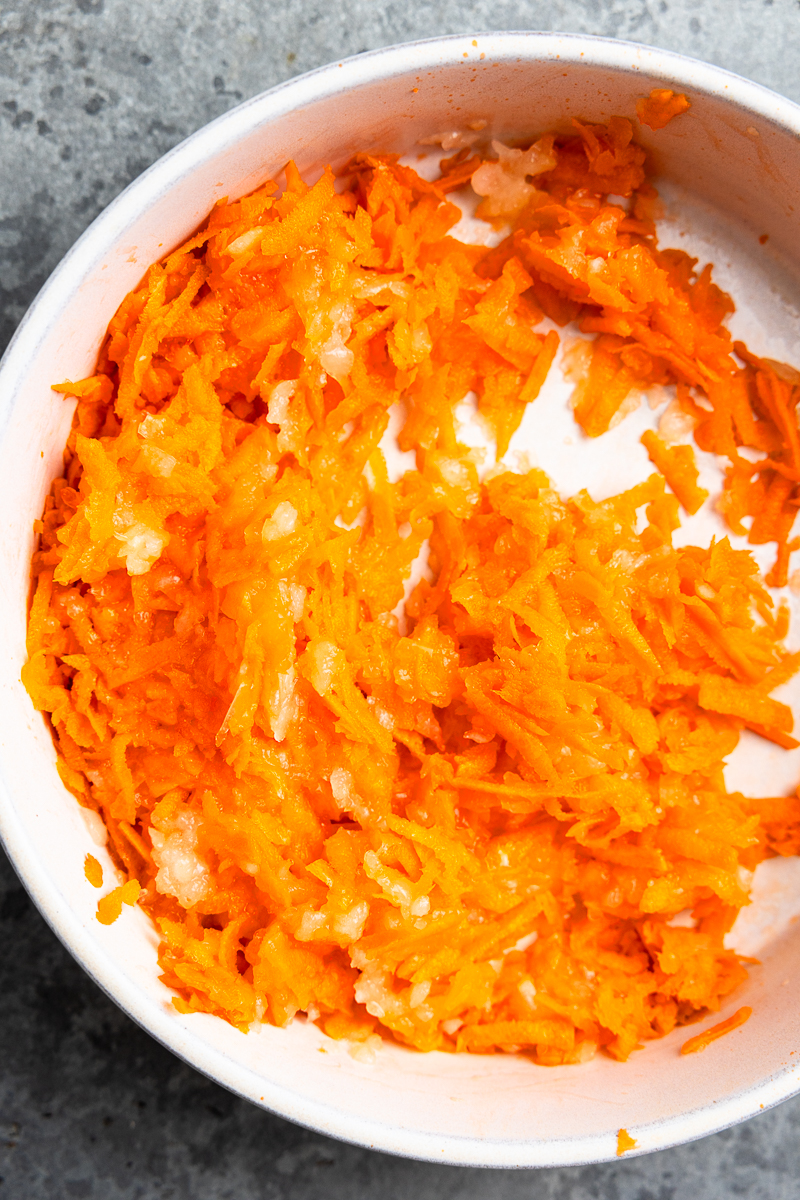 grated onion and carrot in a bowl