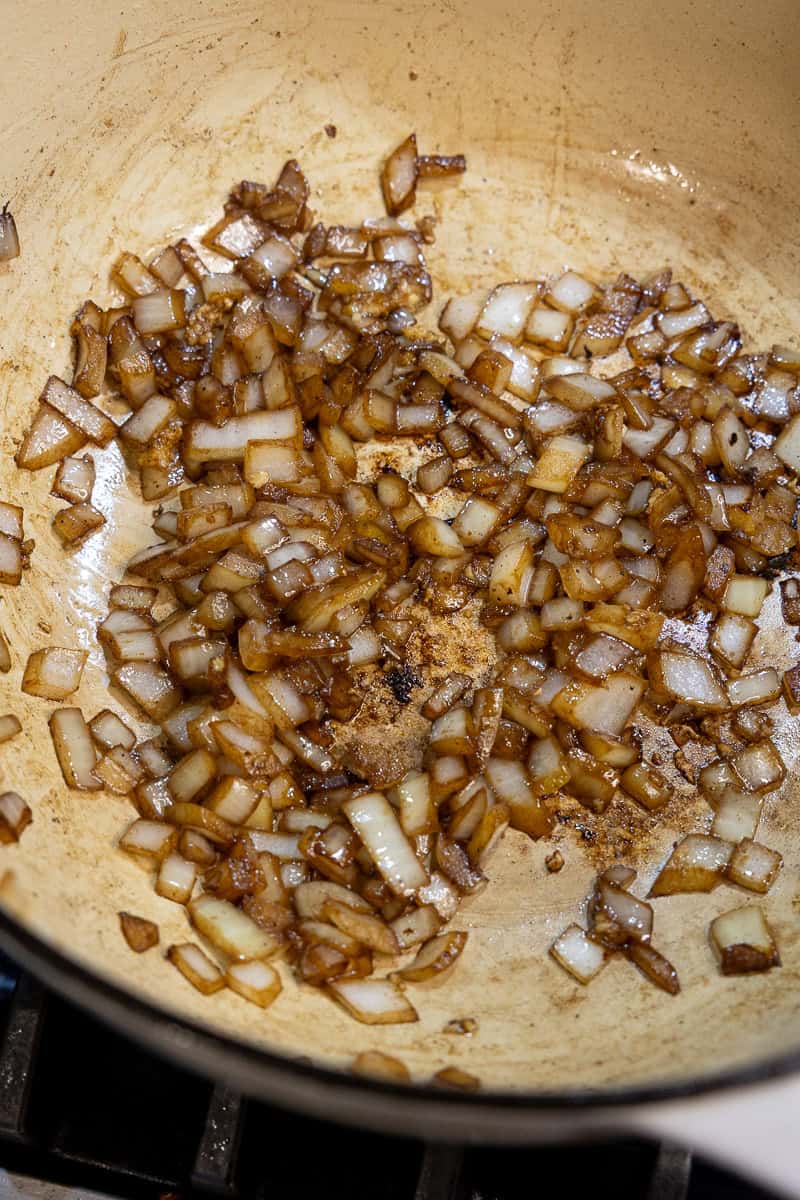 Sautéed diced onion in a dutch oven.