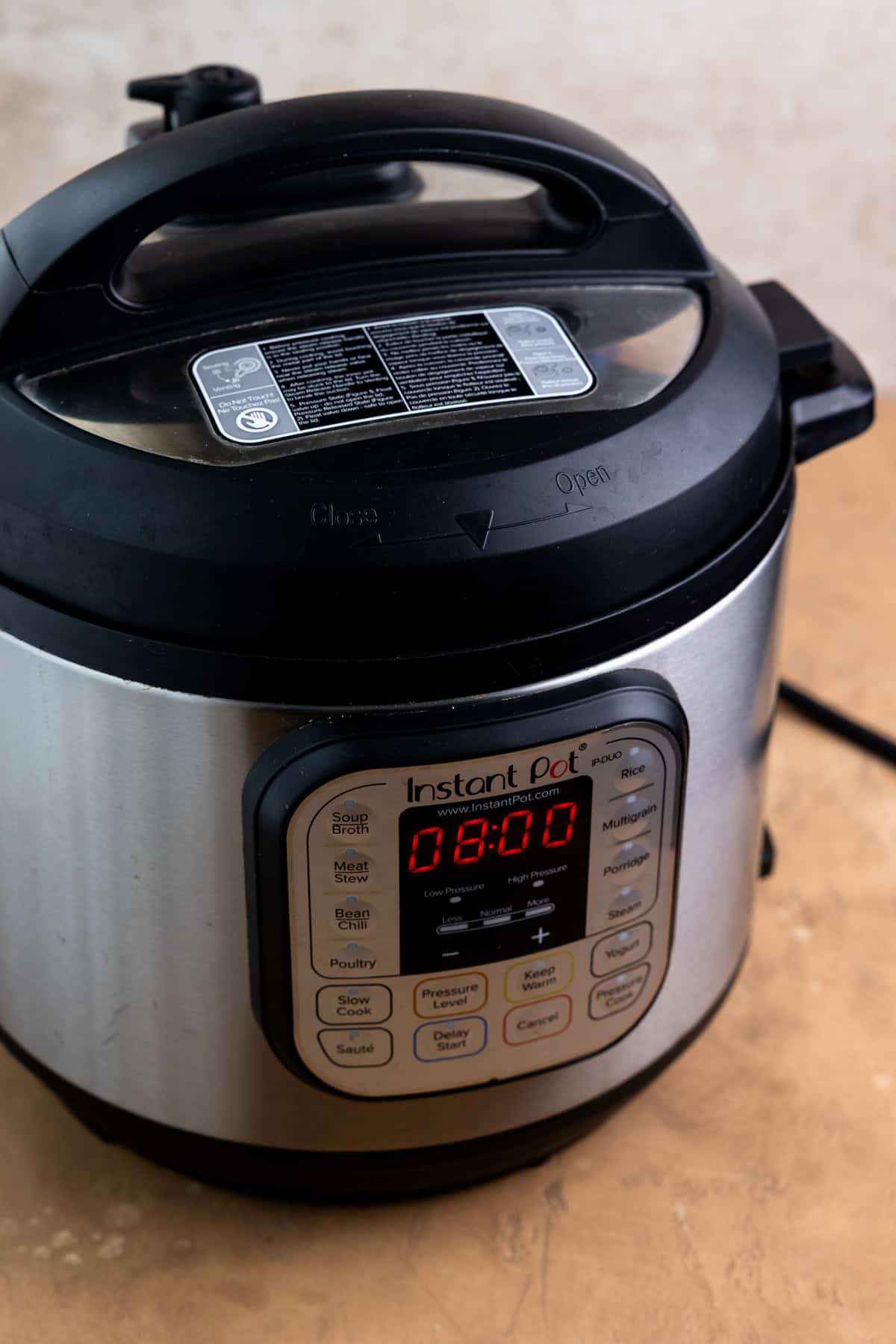 Instant pot with lid on top and yogurt timer set to 8 hours.