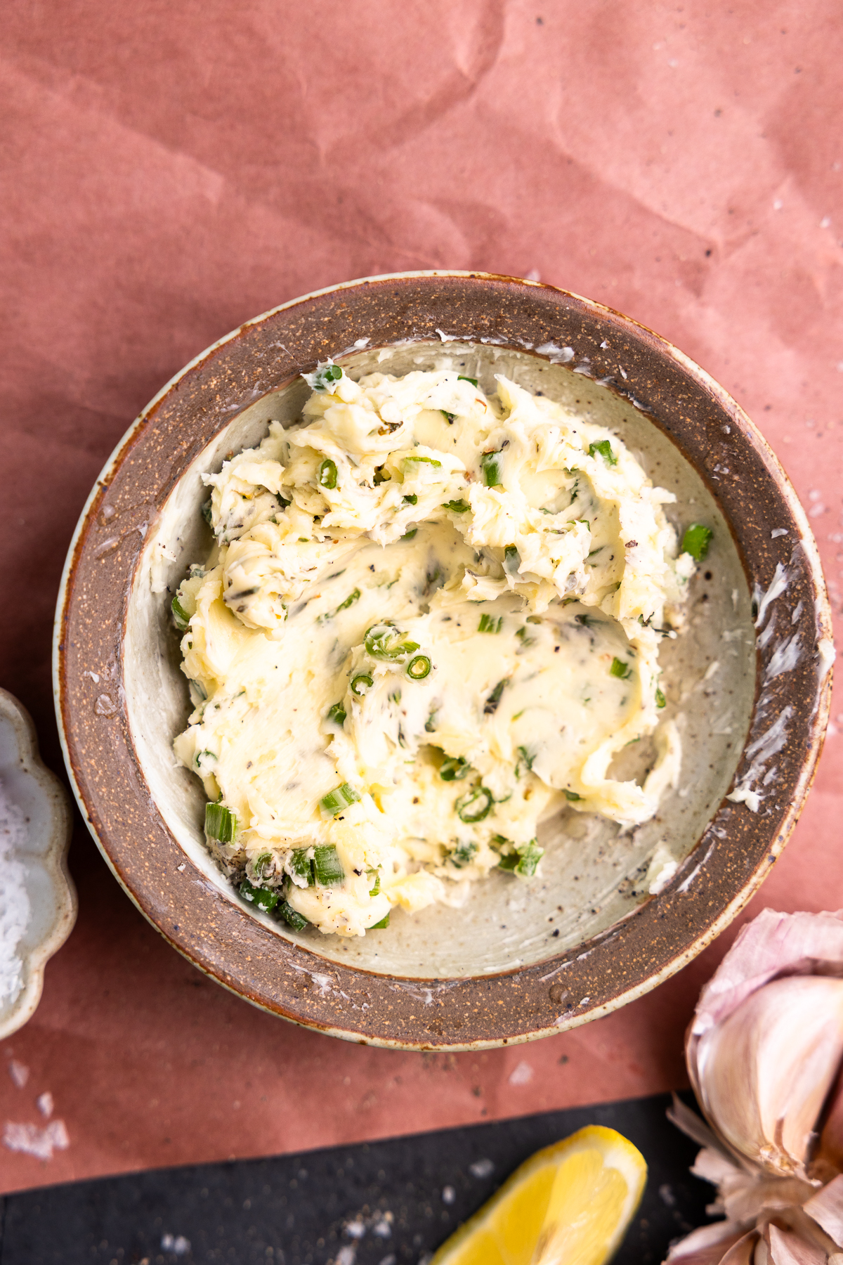 Garlic herb butter mixed together in a bowl.